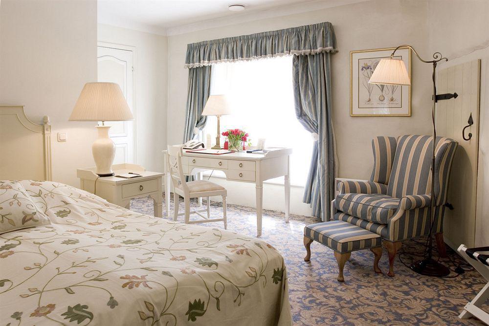 Schloessle Hotel - Small Luxury Hotels Of The World Talin Quarto foto A room at the hotel